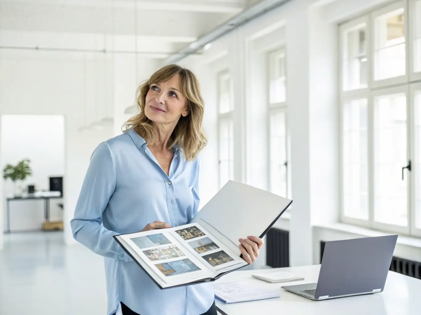 A professional administrative assistant efficiently manages schedules and communications in a modern office setting.